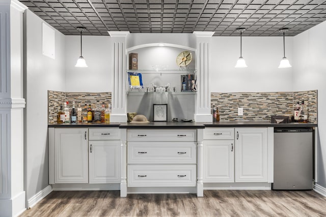 kitchen with dishwashing machine, white cabinetry, light wood-style floors, tasteful backsplash, and dark countertops