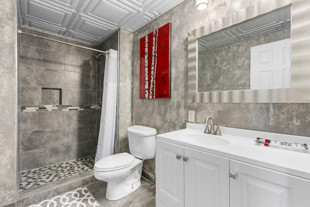 bathroom featuring vanity, an ornate ceiling, a tile shower, and toilet