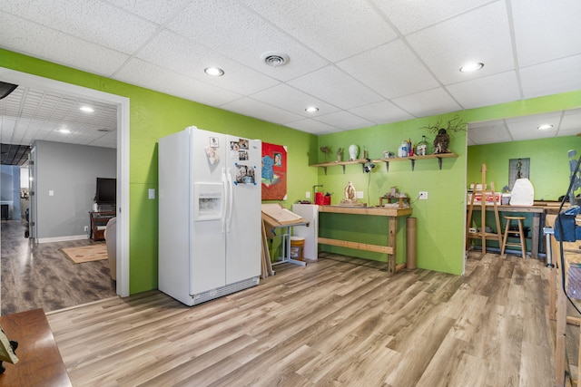 interior space featuring visible vents, a drop ceiling, wood finished floors, and recessed lighting