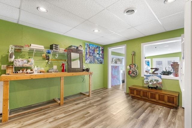 interior space with visible vents, a drop ceiling, wood finished floors, and recessed lighting