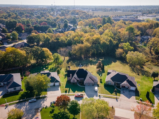 birds eye view of property with a residential view