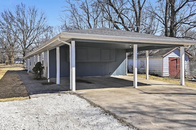 exterior space with driveway and a carport