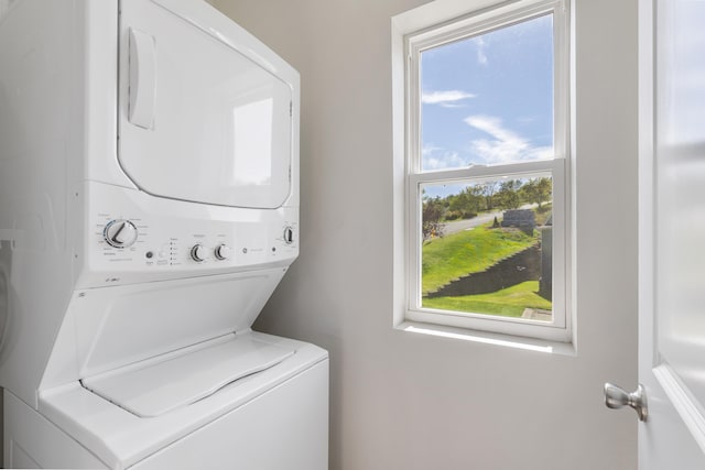 laundry area with laundry area and stacked washing maching and dryer