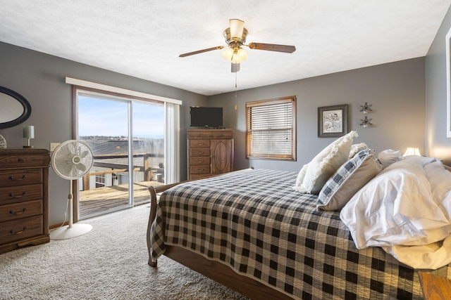 bedroom with access to outside, a textured ceiling, ceiling fan, and carpet flooring