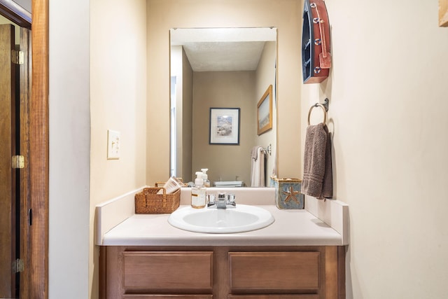 half bathroom featuring toilet and vanity