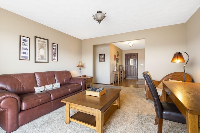 living area with light colored carpet