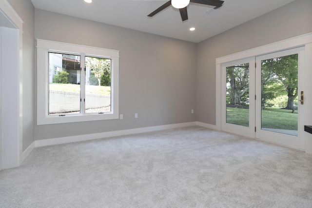 carpeted empty room featuring recessed lighting, a healthy amount of sunlight, and baseboards