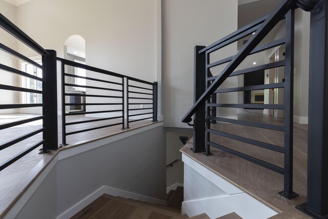 stairs featuring baseboards and wood finished floors