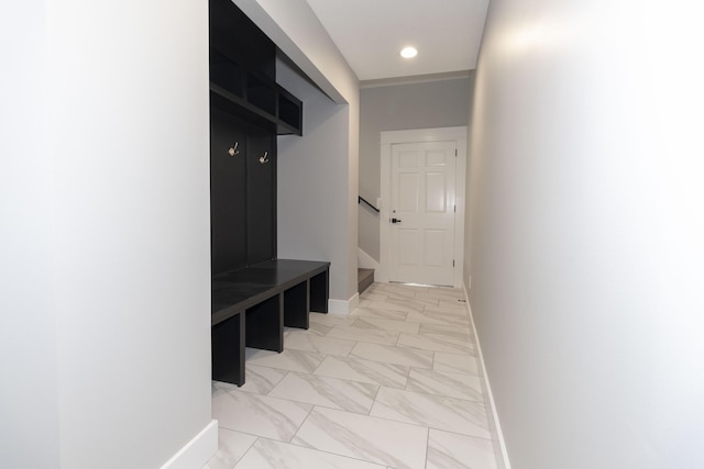 mudroom featuring marble finish floor, recessed lighting, and baseboards