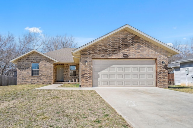 single story home with brick siding, concrete driveway, fence, a garage, and a front lawn