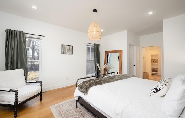 bedroom featuring baseboards, recessed lighting, and light wood-style floors