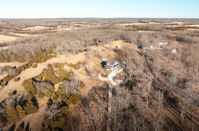 birds eye view of property with a rural view