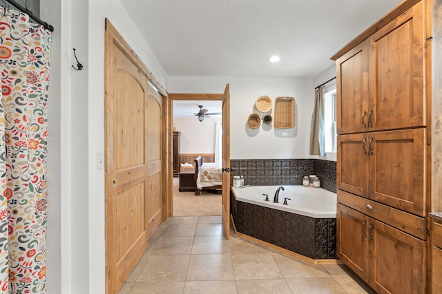 bathroom featuring a garden tub, tile patterned flooring, curtained shower, and ensuite bathroom