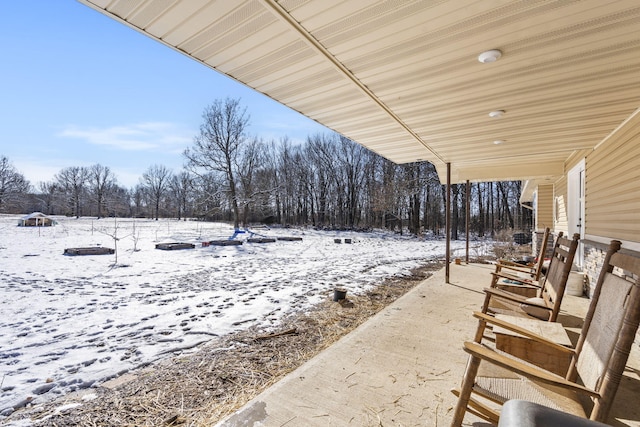 view of snow covered patio