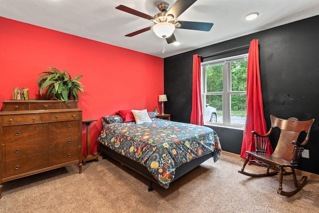 carpeted bedroom with a ceiling fan