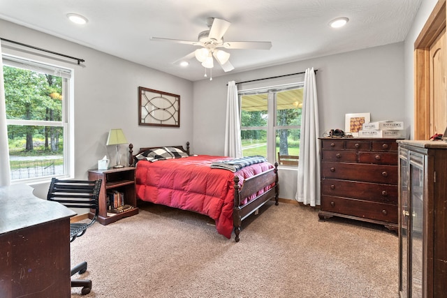 bedroom featuring recessed lighting, a ceiling fan, and light colored carpet