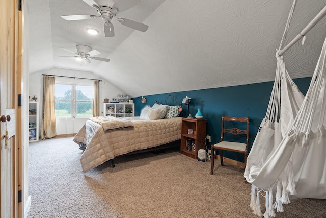 carpeted bedroom featuring vaulted ceiling, a textured ceiling, and ceiling fan