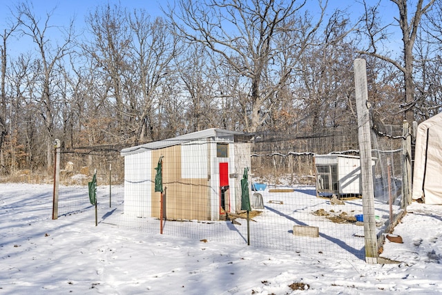 yard covered in snow featuring an outbuilding and central air condition unit