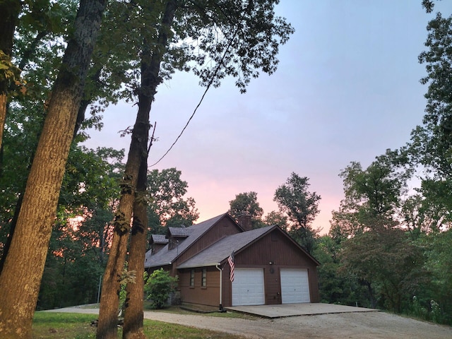 view of front of home with a garage and concrete driveway