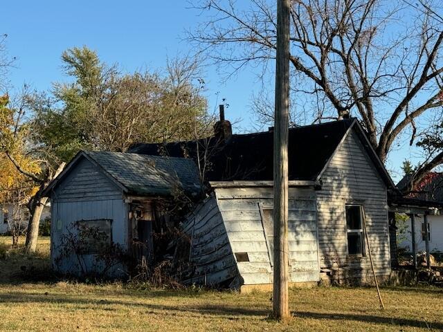 view of home's exterior with a yard