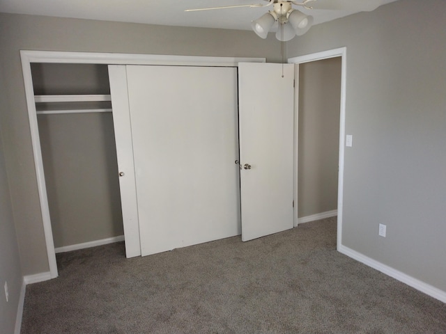 unfurnished bedroom with a closet, carpet flooring, a ceiling fan, and baseboards