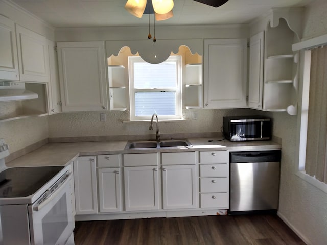 kitchen featuring white cabinetry, appliances with stainless steel finishes, open shelves, and a sink