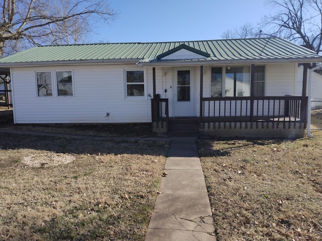 view of front of home with covered porch and metal roof