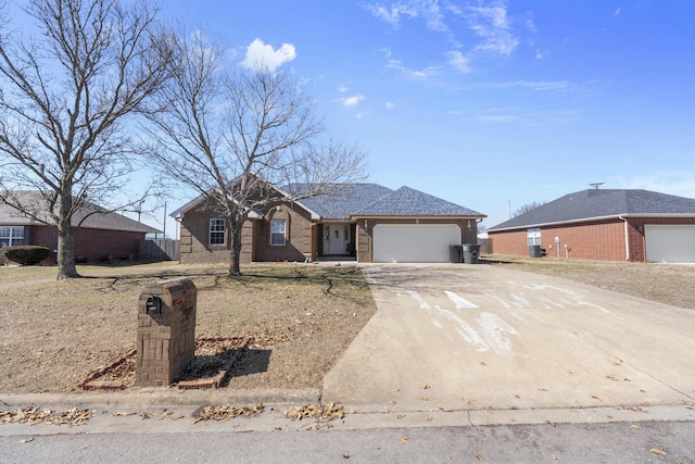 ranch-style home featuring driveway, a garage, and brick siding