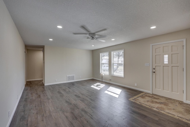 entryway featuring dark wood-style floors, recessed lighting, visible vents, and baseboards