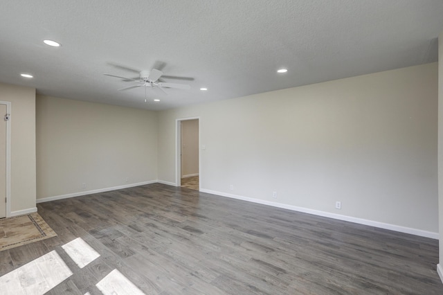 unfurnished room featuring a ceiling fan, recessed lighting, baseboards, and wood finished floors