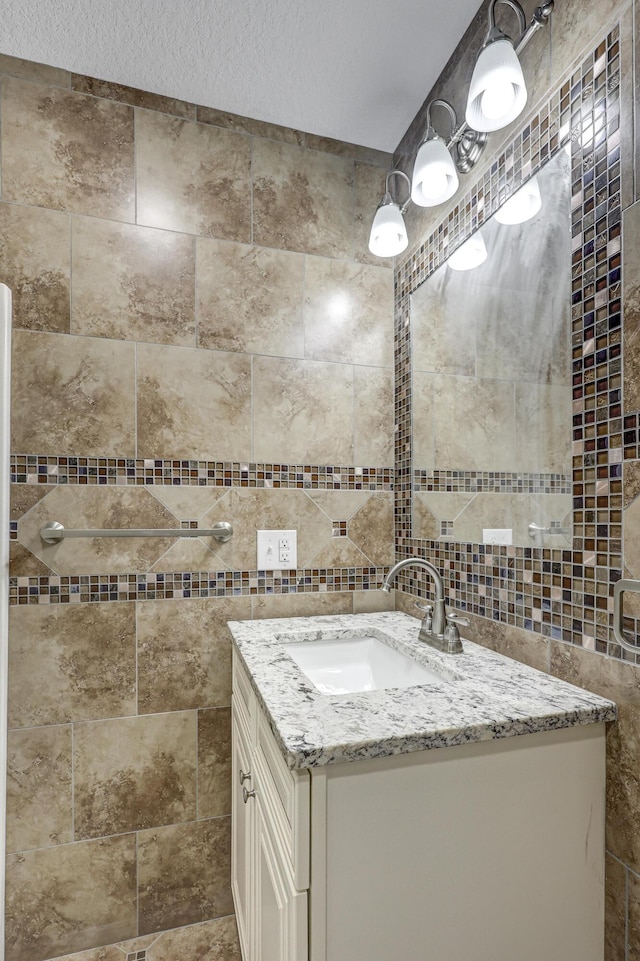 bathroom with vanity and a textured ceiling