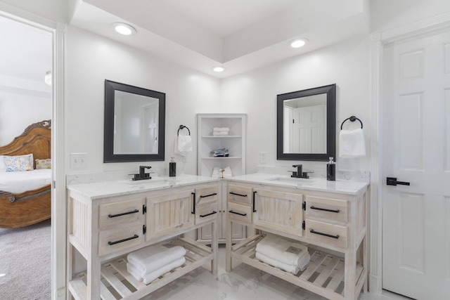 ensuite bathroom featuring recessed lighting, vanity, and ensuite bath