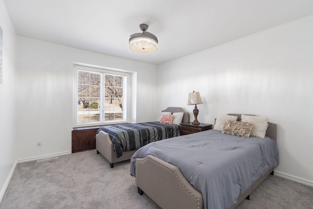 bedroom with carpet and baseboards