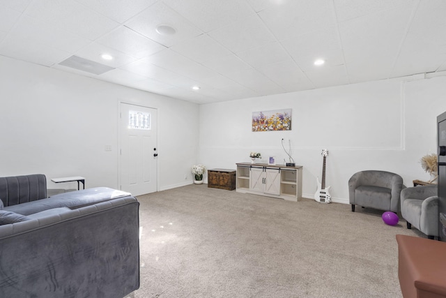 living room with carpet floors, baseboards, a drop ceiling, and recessed lighting