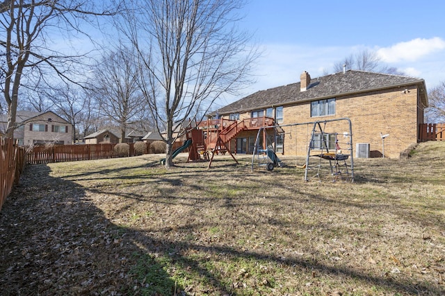 view of yard featuring a playground and a fenced backyard