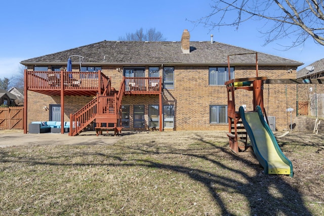 exterior space featuring a patio, stairway, fence, a yard, and an outdoor living space