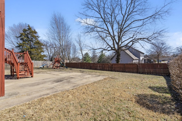 view of yard featuring a playground and fence private yard