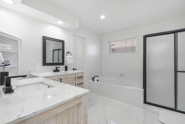 bathroom with marble finish floor, a garden tub, recessed lighting, a stall shower, and vanity