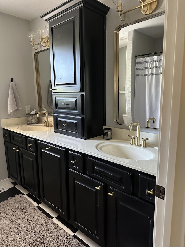 full bathroom featuring double vanity and a sink