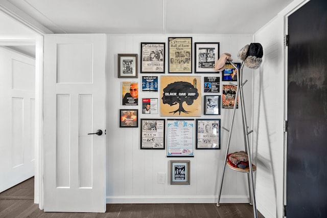 interior space with baseboards and wood finished floors