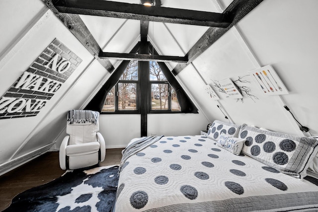 bedroom with lofted ceiling with beams, baseboards, and wood finished floors