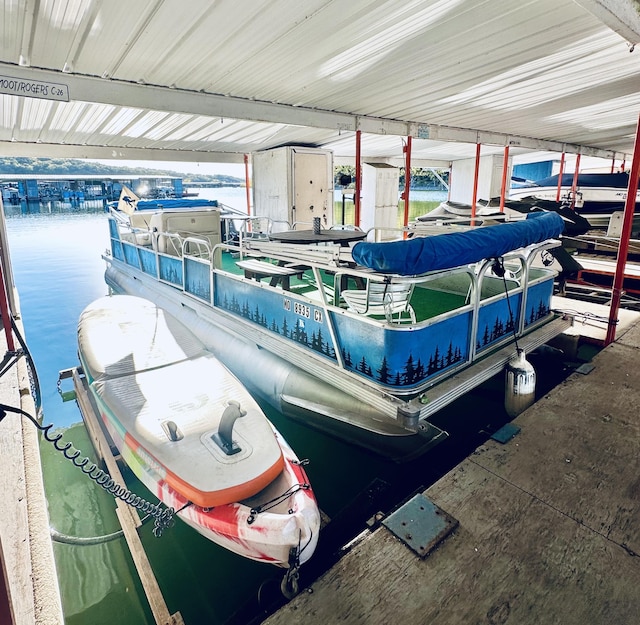 view of dock with boat lift