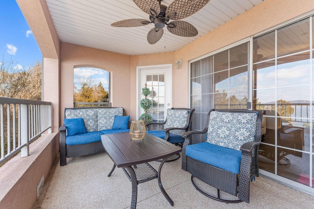 view of patio / terrace featuring ceiling fan and an outdoor living space