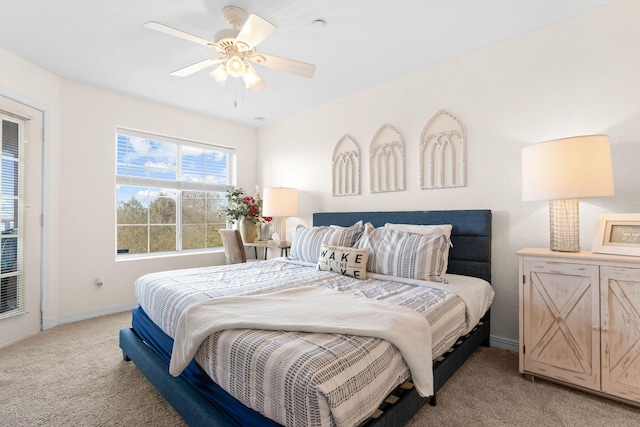 bedroom with baseboards, ceiling fan, and light colored carpet