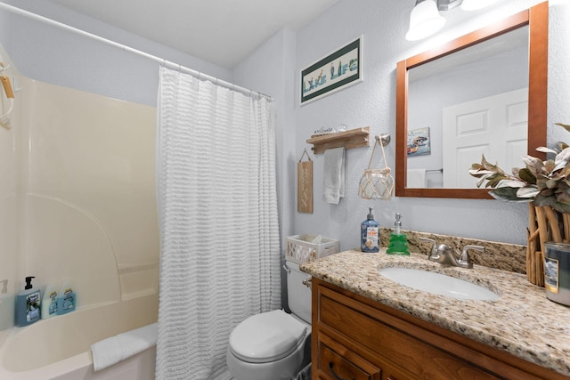 full bathroom with a textured wall, shower / tub combo, vanity, and toilet