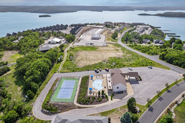 birds eye view of property featuring a water view and a residential view