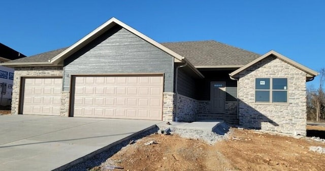 view of front of home featuring a garage and concrete driveway