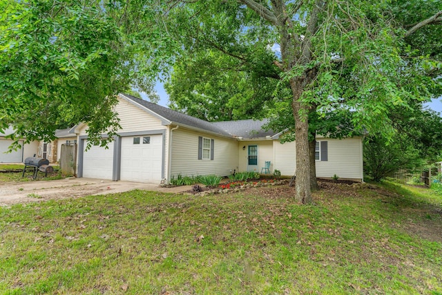 single story home featuring driveway, a garage, and a front yard