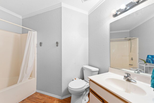 full bath featuring crown molding, toilet, shower / bath combo with shower curtain, vanity, and wood finished floors