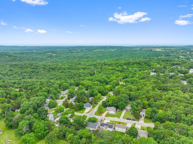 aerial view featuring a view of trees